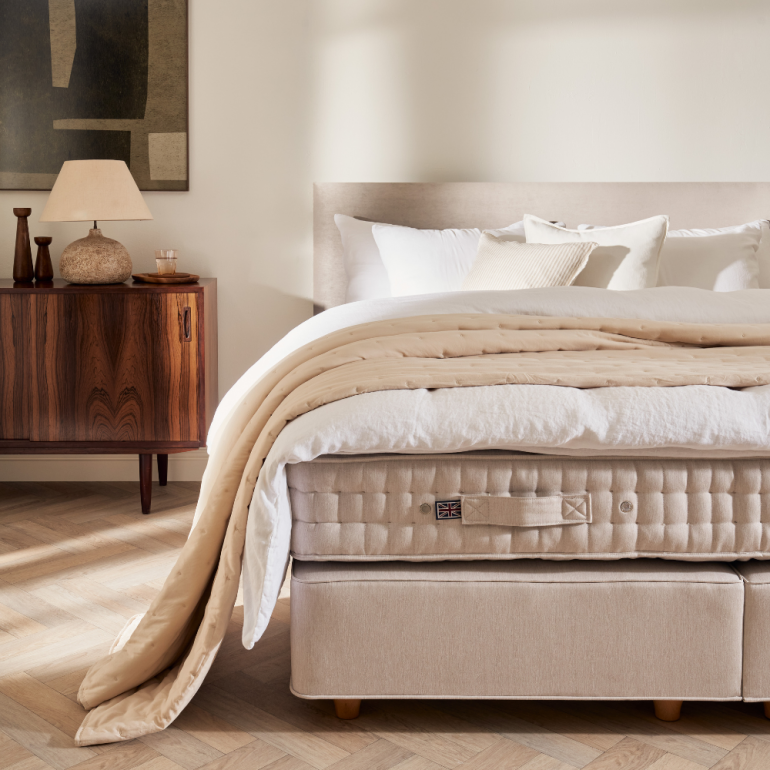 Cosy Nordic style Vispring Bed in neutral colour palette
