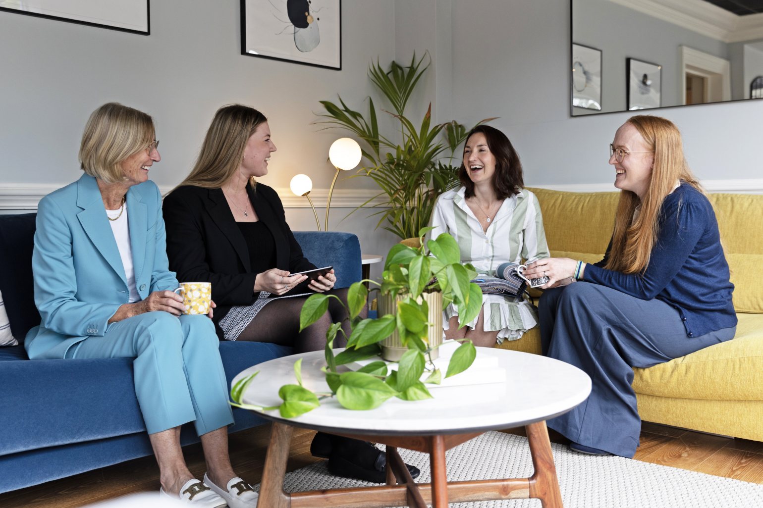 snuginteriors all female team in the showroom enjoying the sofas