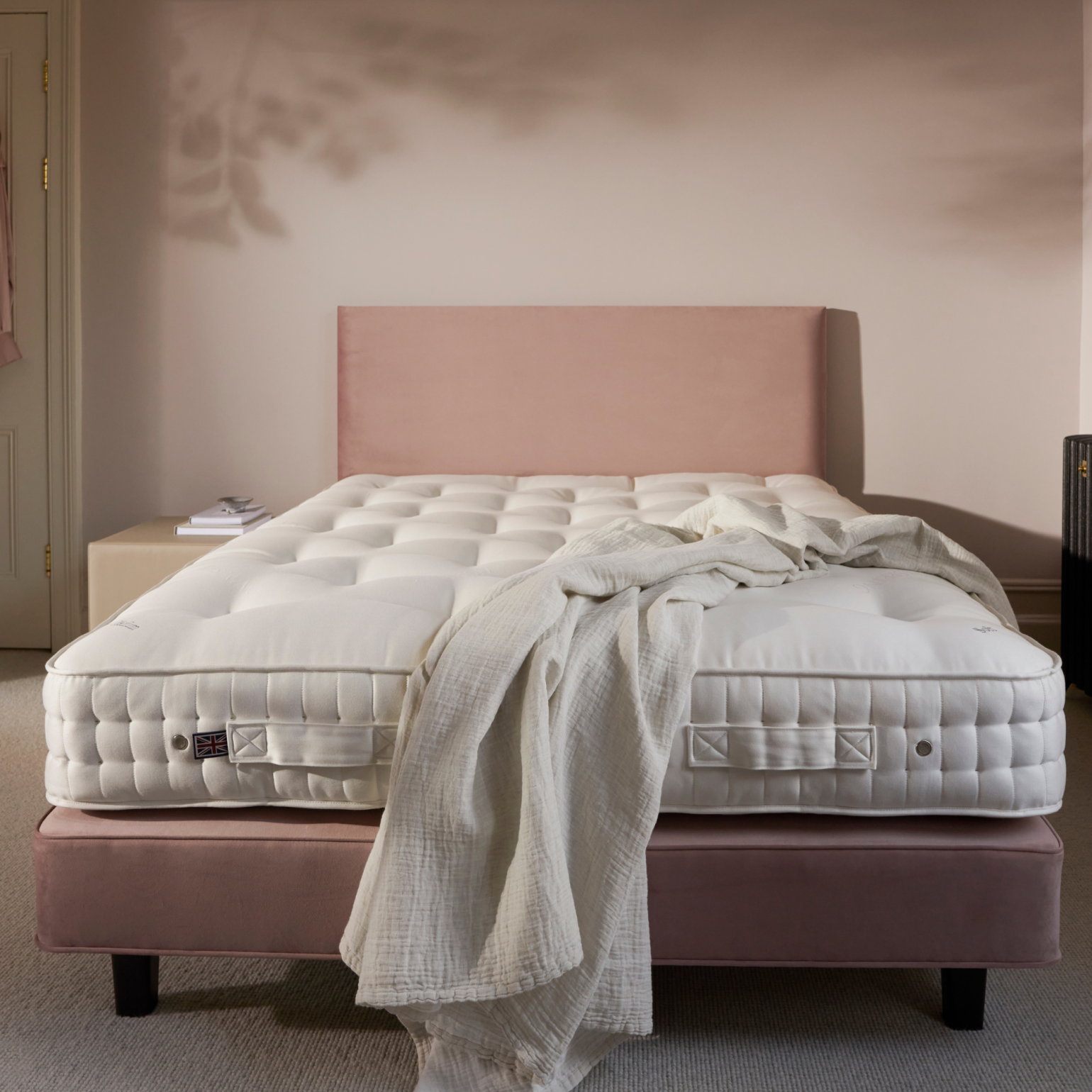 The Vispring Elite Mattress blends responsive pocket spring support with natural layers of British wool and cotton for balanced comfort. Naturally breathable and chemical-free, it regulates temperature year-round while promoting healthy spinal alignment. Expertly handcrafted in Britain, it’s backed by a 30-year guarantee for lasting luxury.


	1,254 hand-nested vanadium steel pocket springs (in King size) for responsive support.
	 
	Upholstered with breathable British wool and cotton for temperature control.
	 
	Hand-side stitched for strong edge support and durability.
	 
	Available in soft, medium, and firm tensions.
	 


Why It Works for Back Sleepers: The responsive spring system holds hips and shoulders level, while the natural fillings cushion pressure points — helping maintain a healthy spine.

Best For: Those wanting a supportive yet comfortable medium feel mattress with breathable, natural materials and customisable levels of support
