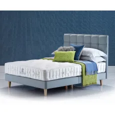 Hazel Natural Deluxe shallow divan on legs, with the Grace headboard in blue