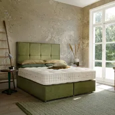 Hypnos Deep Platform Top Divan Base upholstered in Zenith 501 Palm, seen from side view