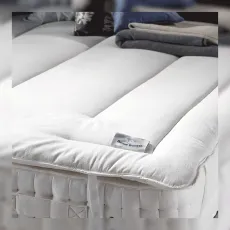 Devon duvet mattress topper on bed