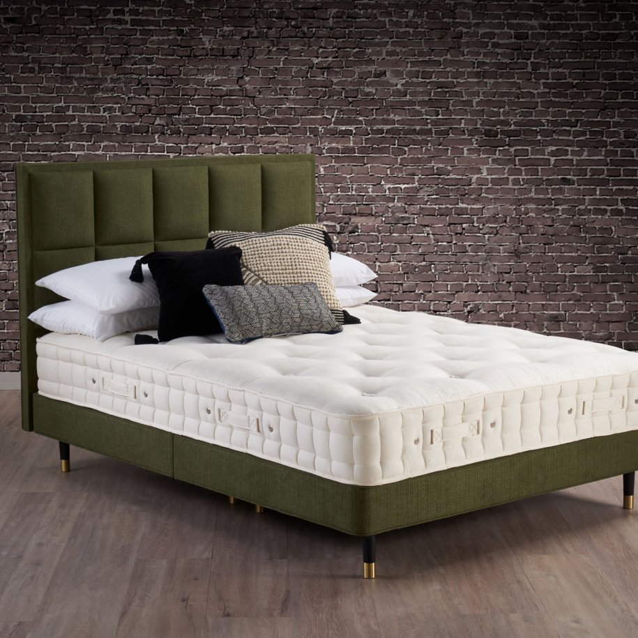 Hypnos Cotton Origins 8 semidressed           Mattress on a shallow divan base on legs with Alexandra headboard in green.